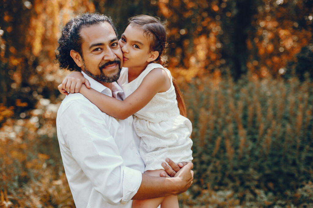 daughter kisses her dad